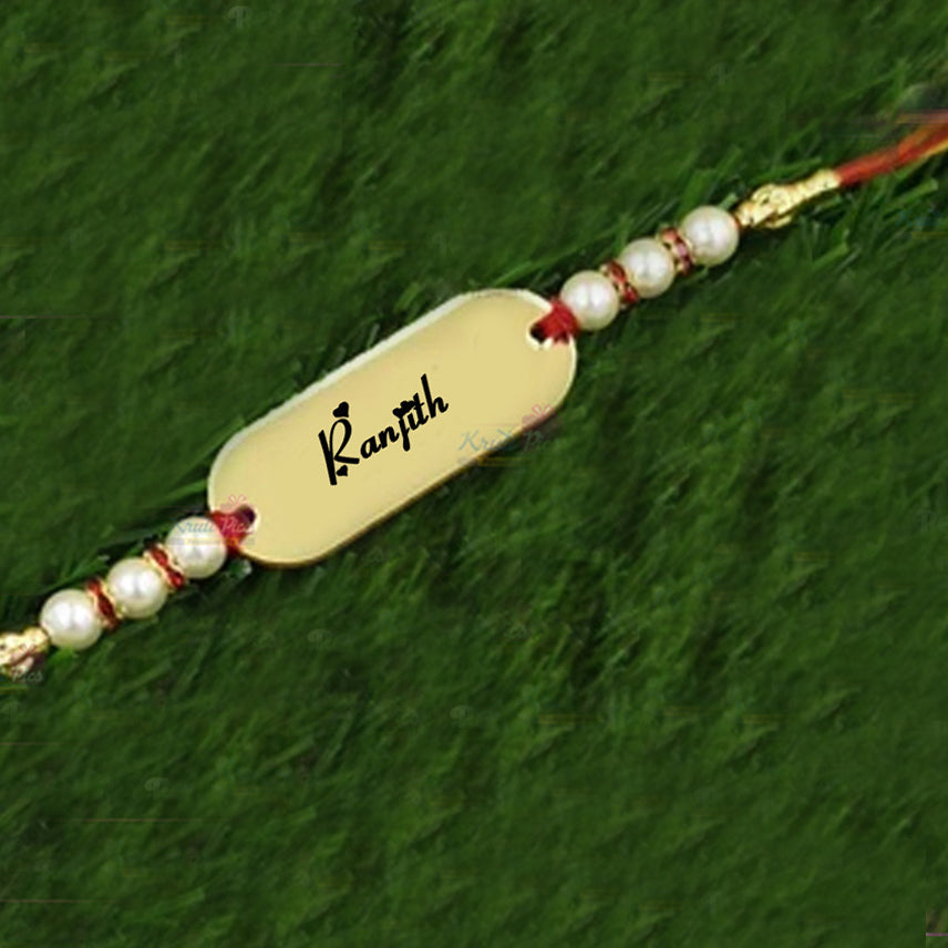 Rakhi With Name on Acrylic Gold Mirror